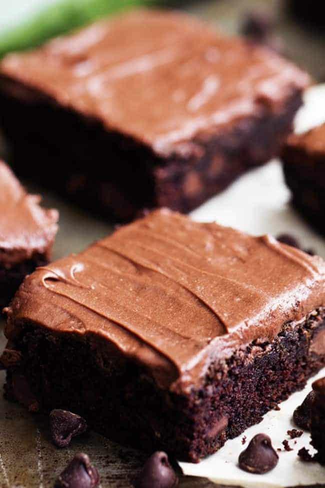 double chocolate zucchini brownies on white paper.