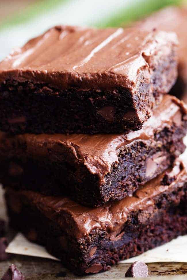 zucchini brownies in a stack.