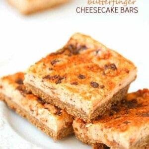 Butterfinger Cheesecake Bars - A crunchy graham cracker crust, then layered with an outrageous, creamy cheesecake mixed with chopped up butterfingers!