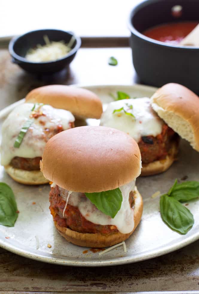 Super Easy Italian Meatball Sliders on a white plate.