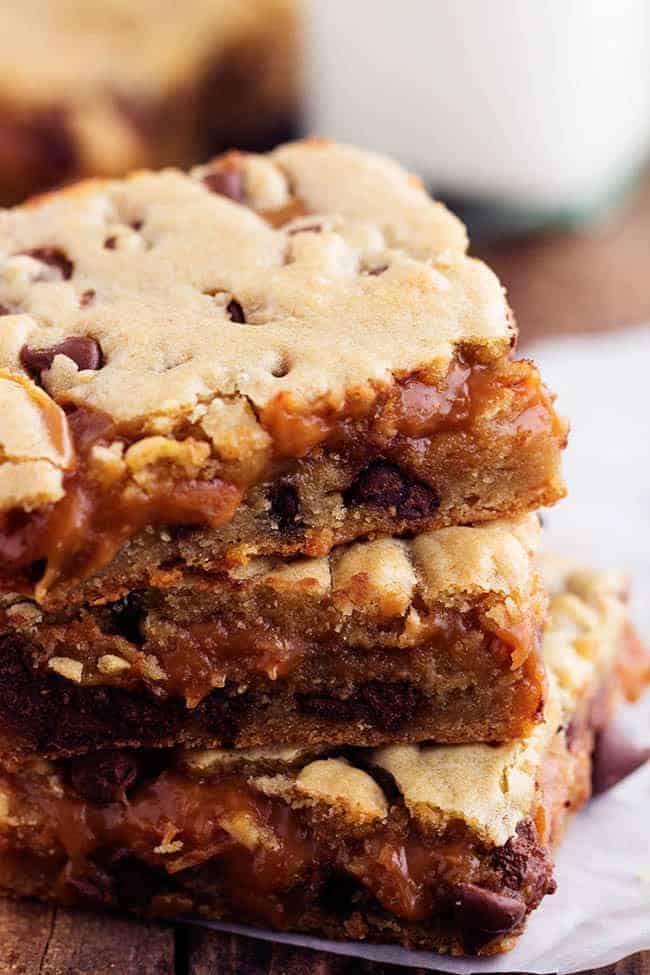 Stack of peanut butter caramel chocolate chip cookie bars.