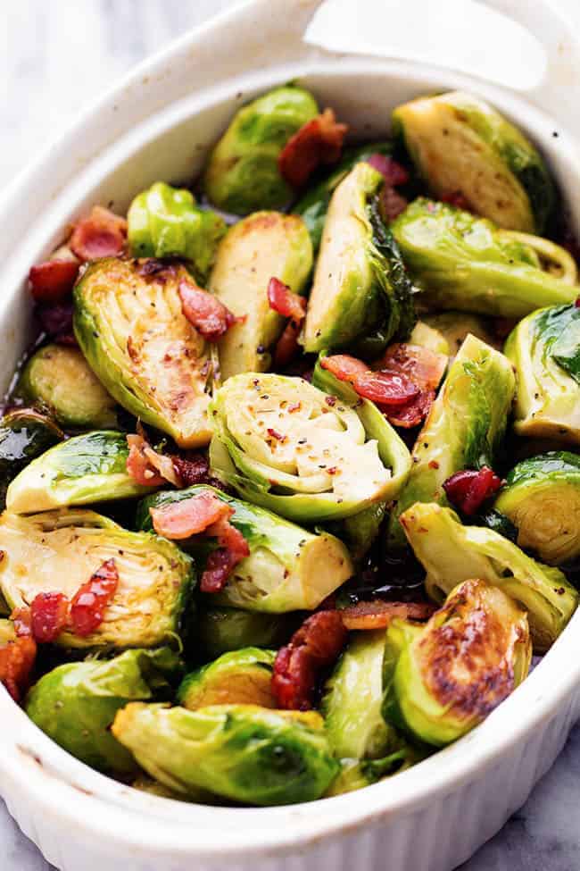 maple bacon brussel sprouts in a white dish.