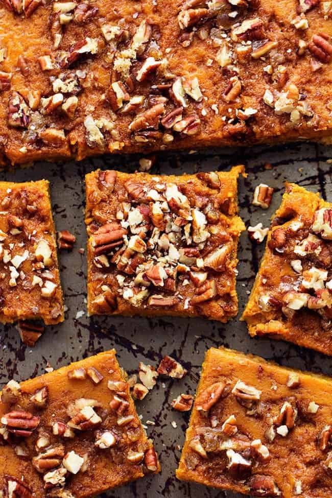 Pumpkin pecan pie bars cut into pieces.