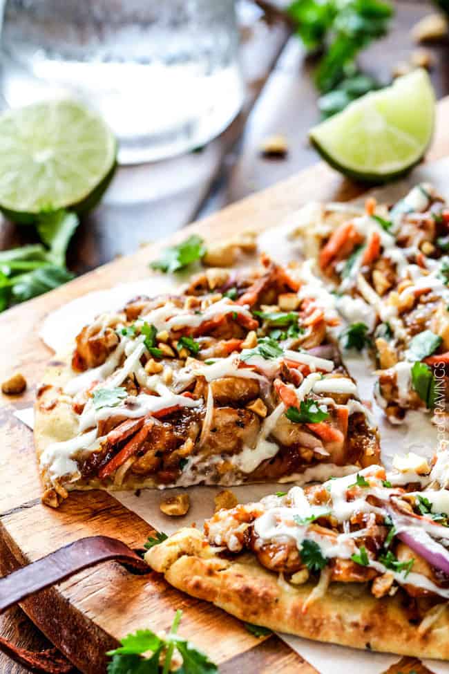 CPK inspired 20 Minute Thai Chicken Flatbread Pizza smothered in easy tangy peanut sauce, tender chicken, mozzarella cheese, crunchy carrots, sprouts and peanuts and the option of creamy coconut yogurt drizzle - an amazing flavor bursting quick dinner at a fraction of the cost.