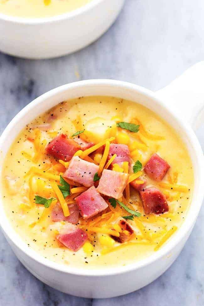 Ham and Potato Cheddar Soup in a white bowl.