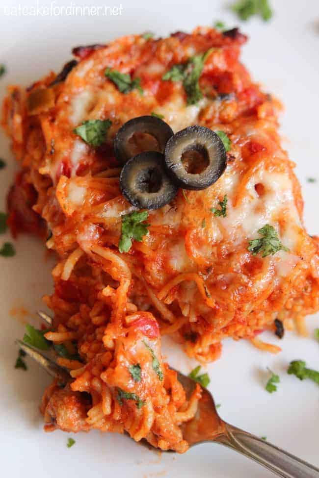 baked tex mex spaghetti on a white plate.