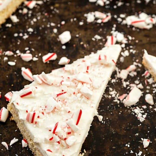 Frosted Peppermint Sugar Cookie Bars - Why do you need ppeppermint bark when you can have these incredibly easy sugar cookie bars? So moist with the creamiest frosting, then topped with chopped candy canes. Only one bowl is needed!