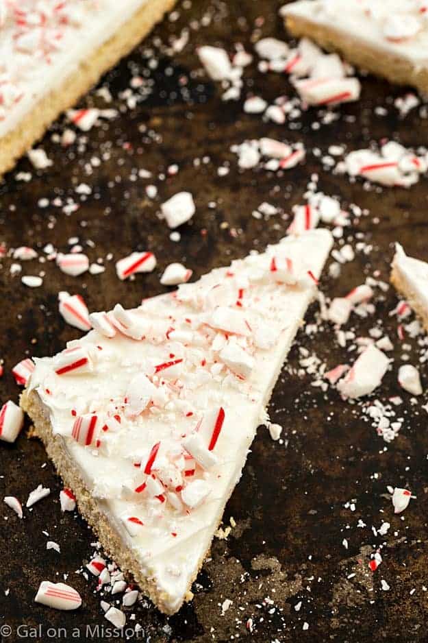 Frosted Peppermint Sugar Cookie Bars - Why do you need ppeppermint bark when you can have these incredibly easy sugar cookie bars? So moist with the creamiest frosting, then topped with chopped candy canes. Only one bowl is needed!