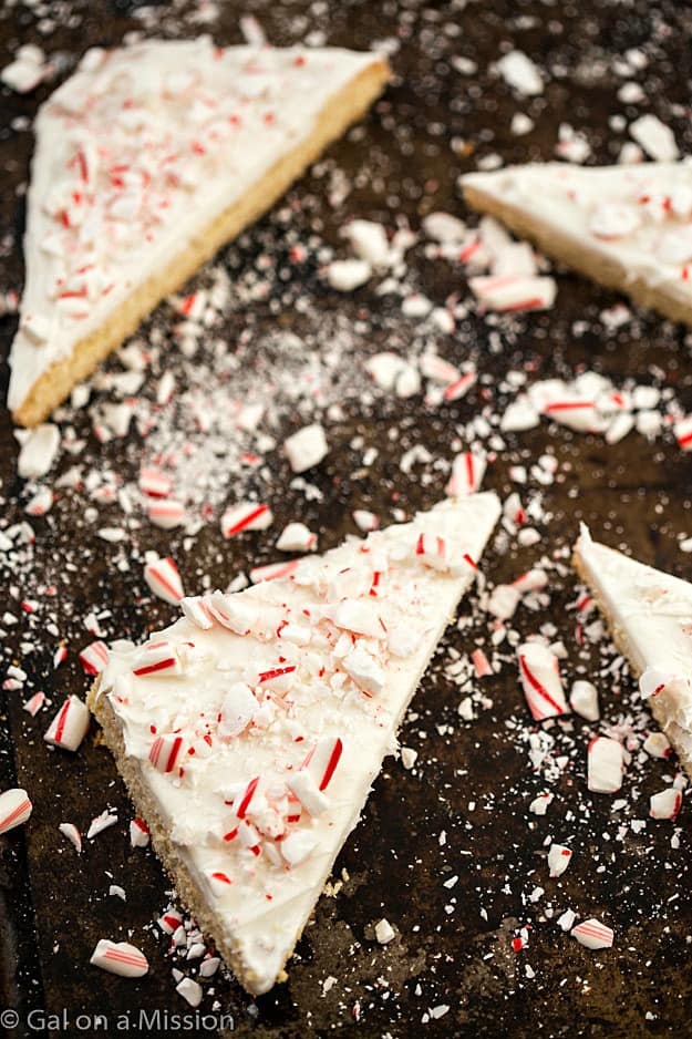 Frosted Peppermint Sugar Cookie Bars - Why do you need ppeppermint bark when you can have these incredibly easy sugar cookie bars? So moist with the creamiest frosting, then topped with chopped candy canes. Only one bowl is needed! 