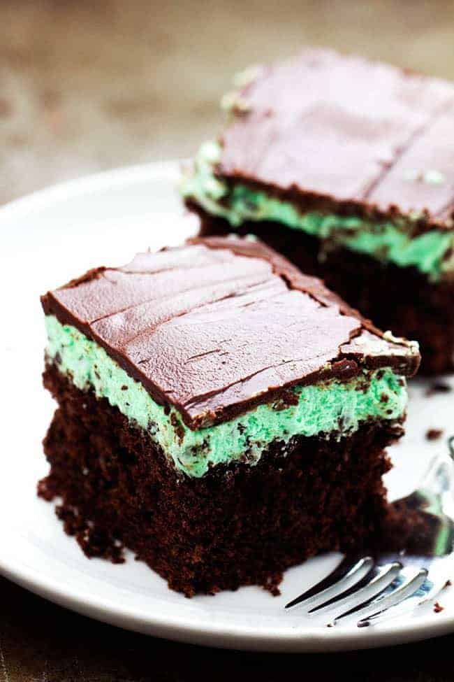 Mint chocolate chip cake on a white plate.