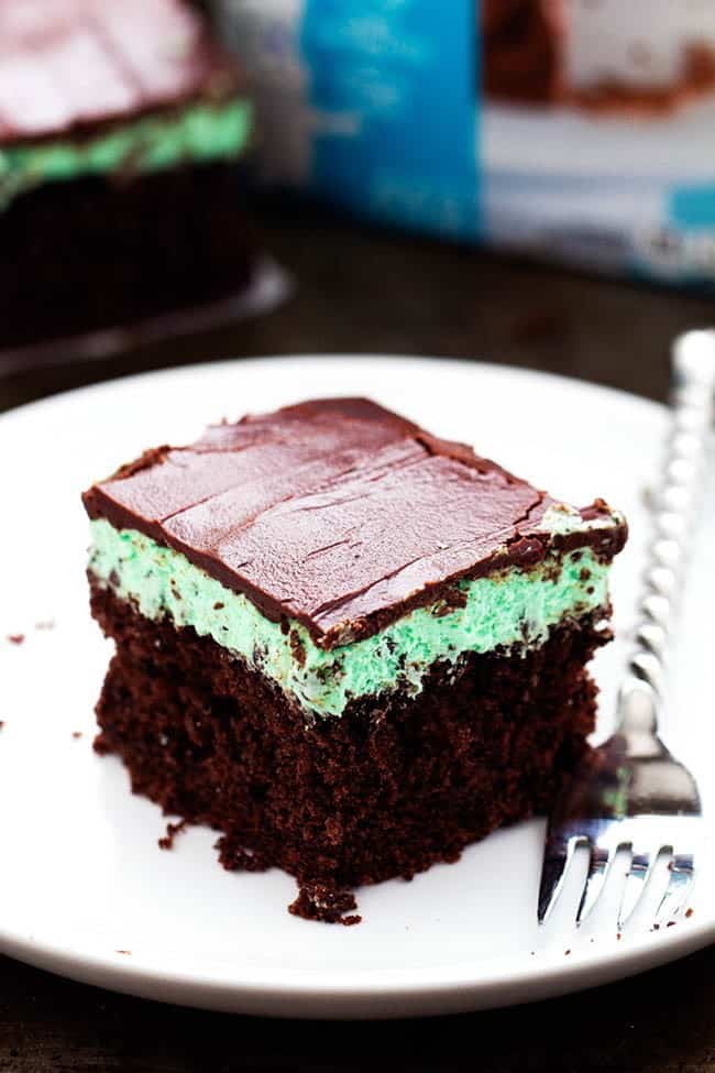 mint cake on a white serving plate with a fork.