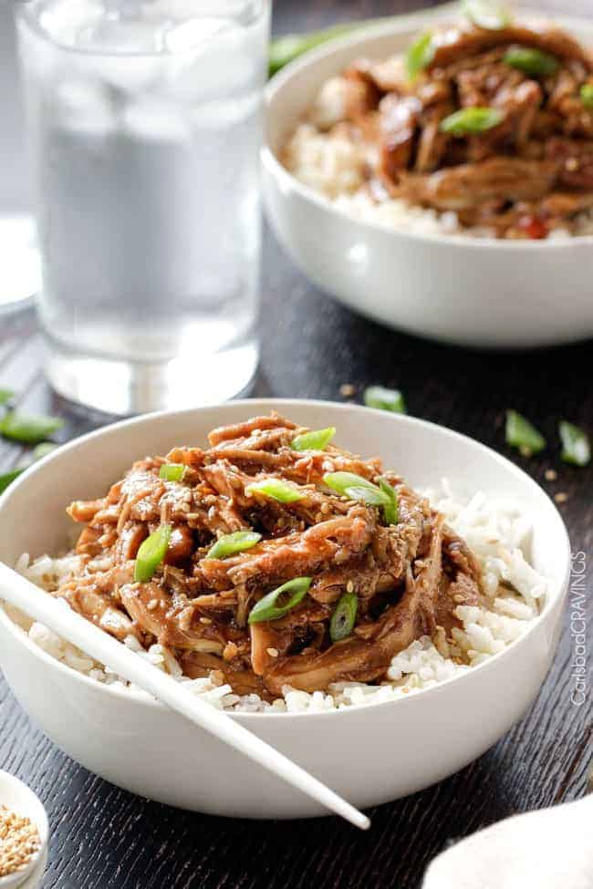 Honey Soy Chicken over rice in white bowl.