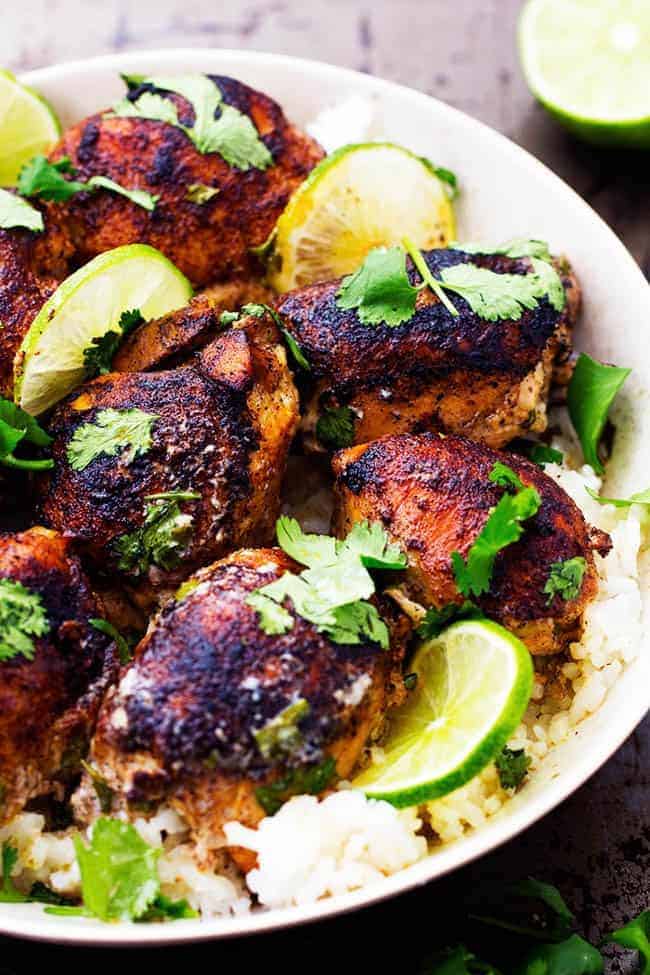 Slow Cooker Creamy Cilantro Lime Chicken over rice in a white bowl.