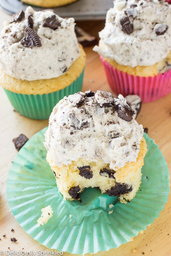 Cookies and Cream Cupcakes with one with a bite taken out of it. 