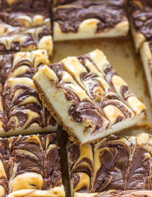 Nutella Swirl Cheesecake Bars sliced into two inch squares. 