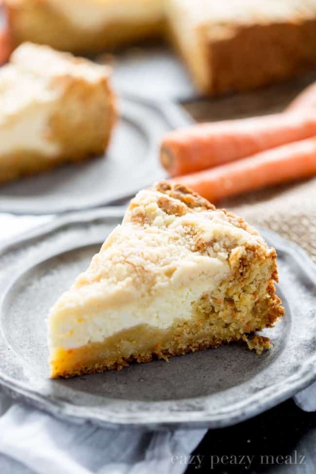 A slice of carrot coffee cake on a gray plate.