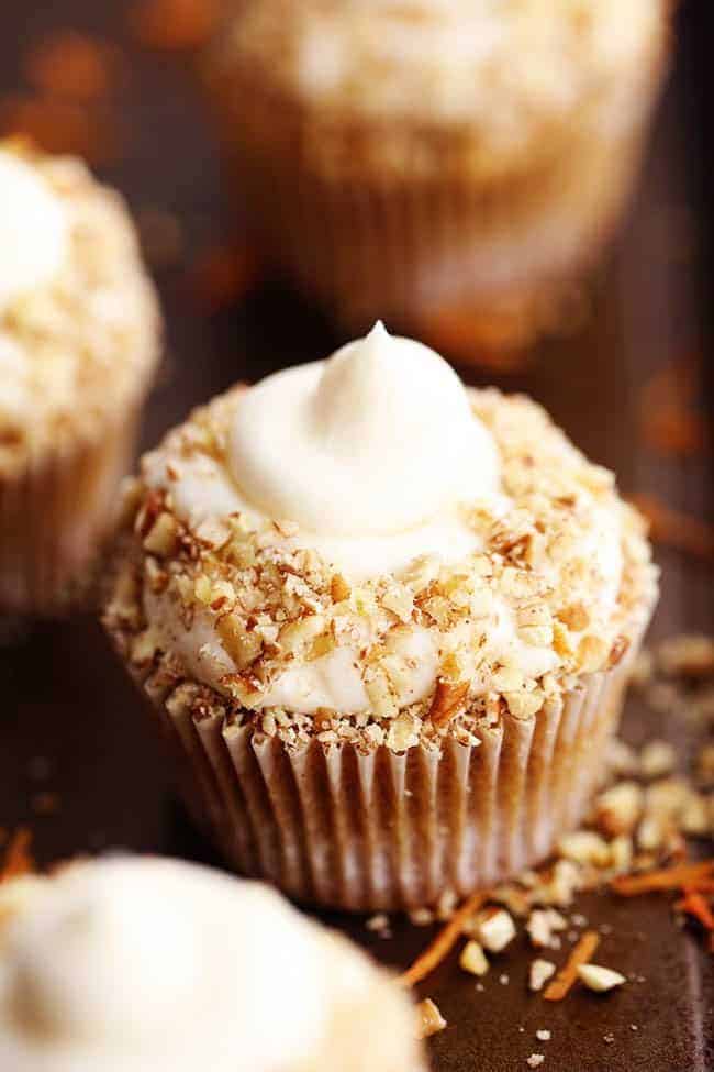 Close up photo of Carrot Cake Cupcakes with White Chocolate Cream Cheese Frosting.