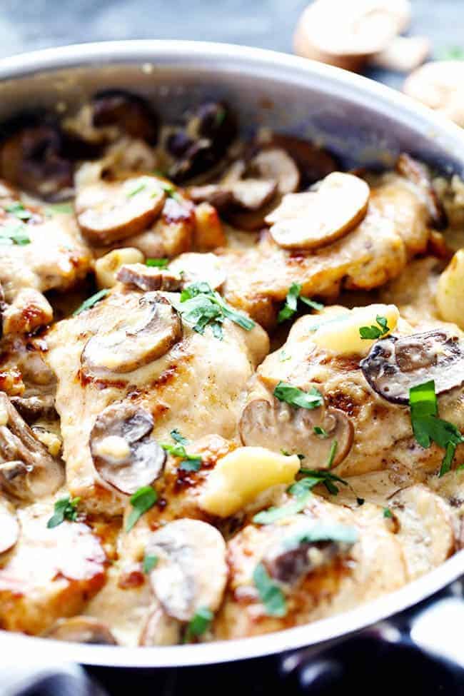 Creamy garlic mushroom chicken in a frying pan.