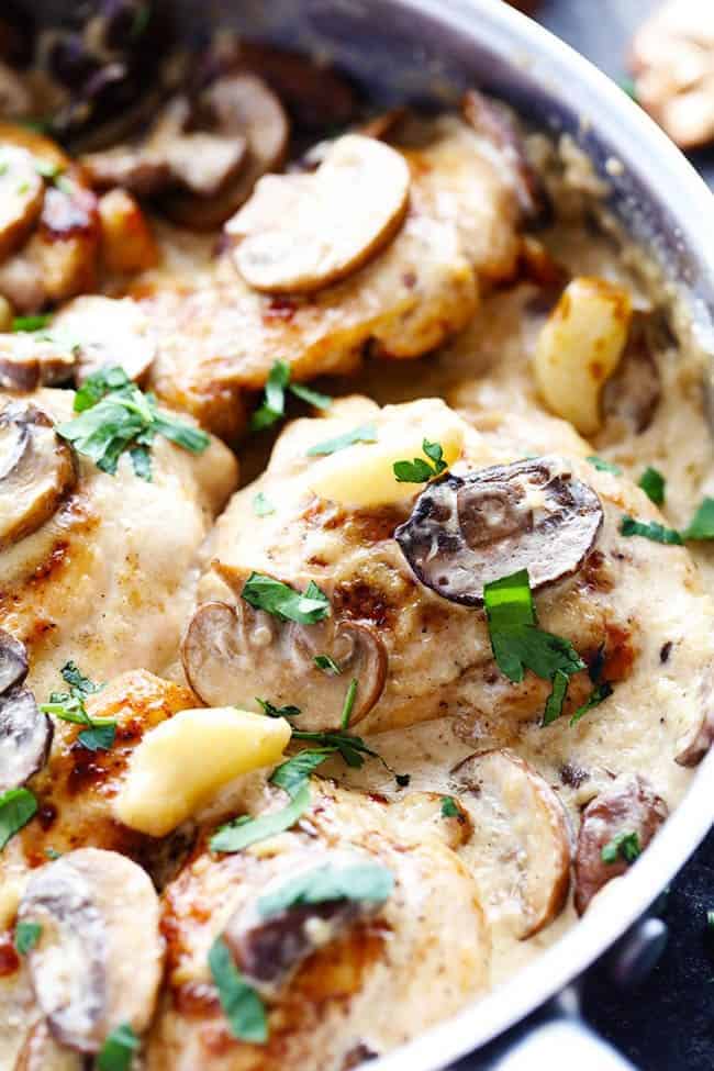 Creamy garlic mushroom chicken in frying pan.