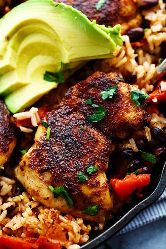 One Pan Southwest Blackened Cajun Chicken with Rice with fresh avocado on the side. 