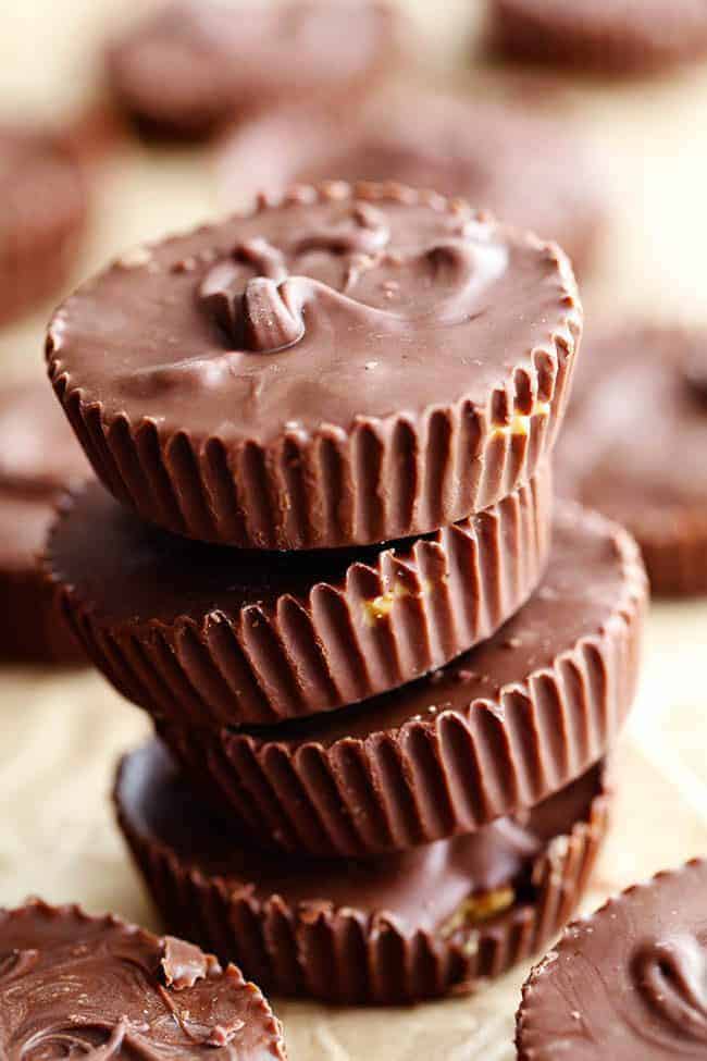 Homemade Reeses peanut butter cups stacked on top of one another.