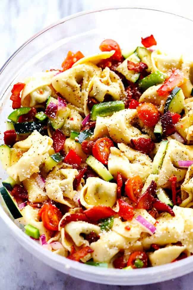 Zesty Tortellini Bacon Vegetable Salad in a clear bowl. 