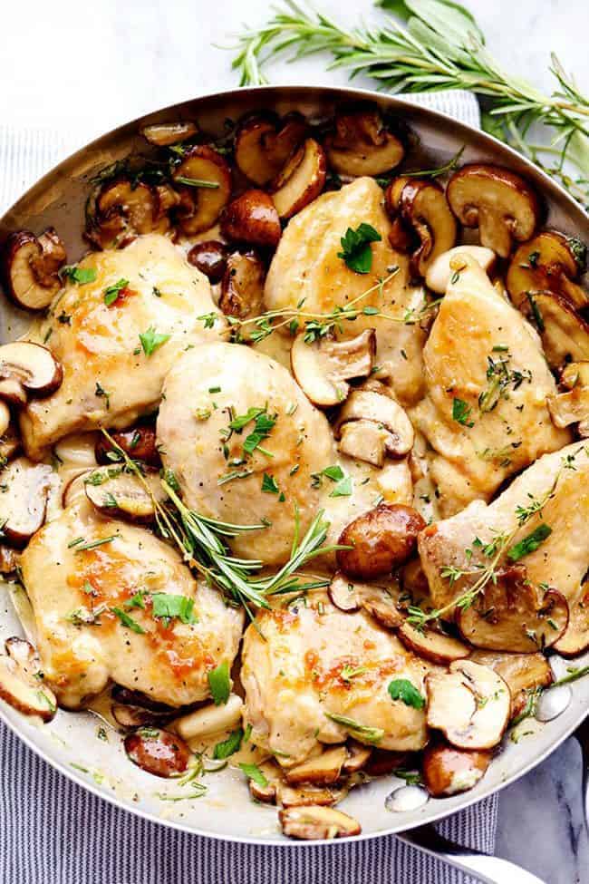 Overhead photo of Creamy Garlic Herb Mushroom Chicken in a metal frying pan. 