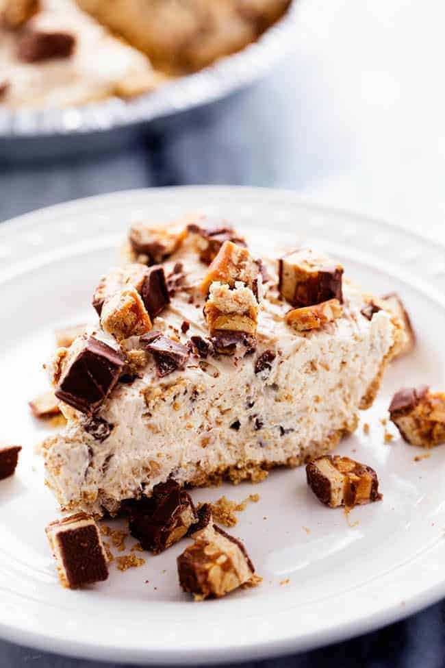 No Bake Snickers Bar Pie on a white plate. 