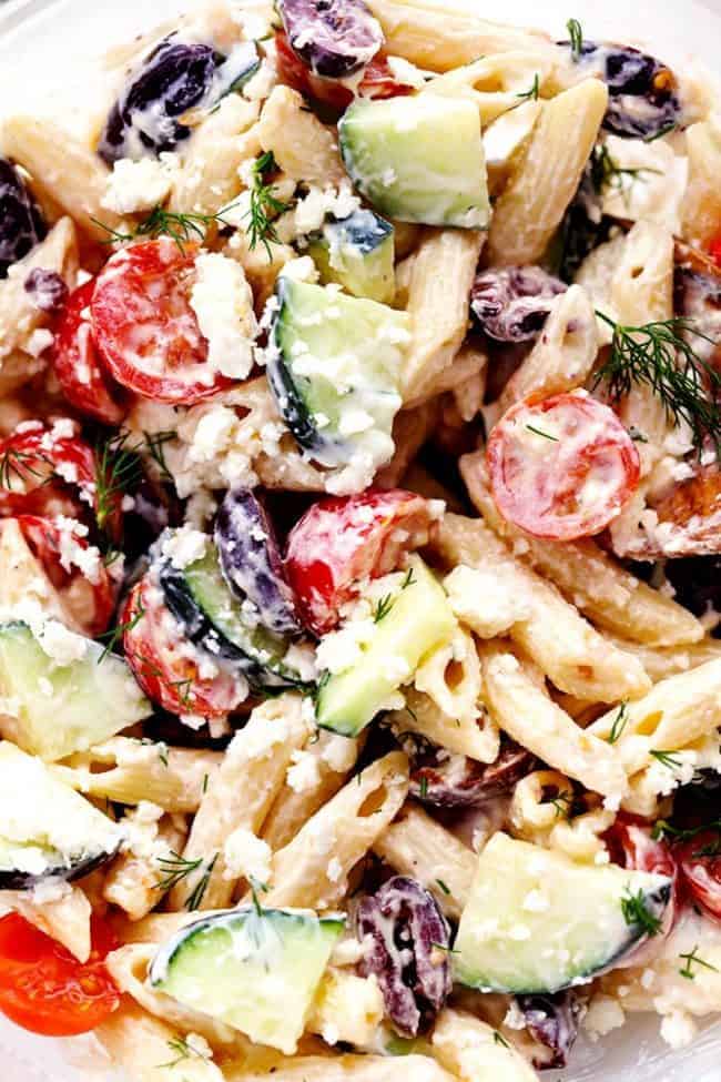 Up close photo of Greek Tzatziki Pasta Salad in a clear bowl. 