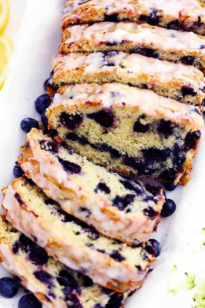 Blueberry Zucchini Bread with a Lemon Glaze that has been sliced. 