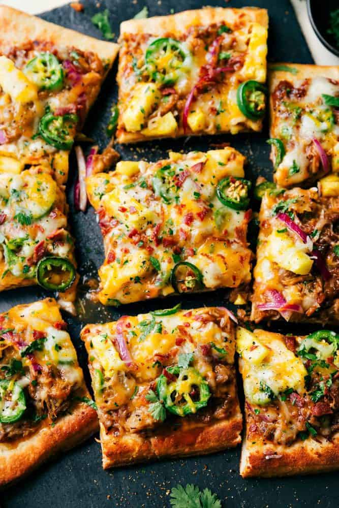 BBQ Pulled Pork Pizza that has been sliced into squares. 