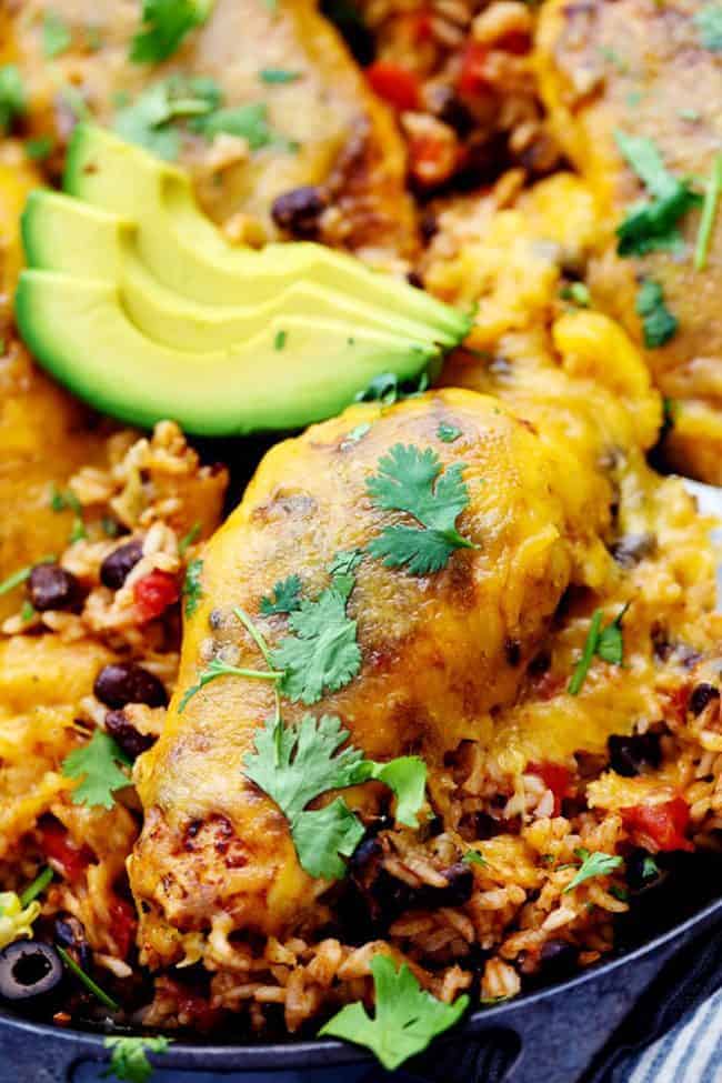 Cheesy Fiesta Chicken and Rice Skillet with fresh avocados on top. 