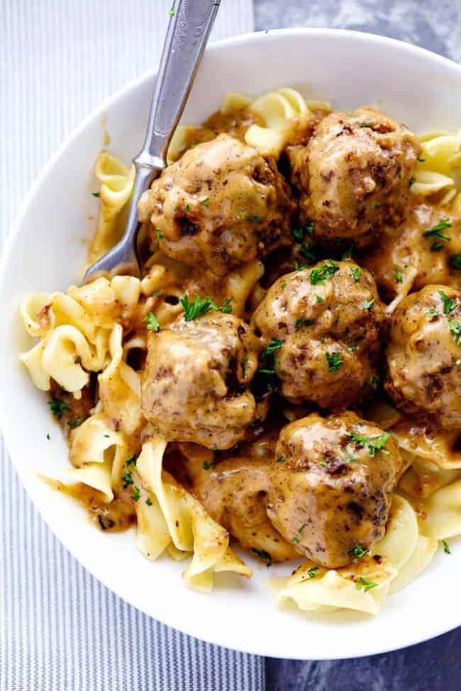 The Best Swedish Meatballs over noodles in a White Bowl 