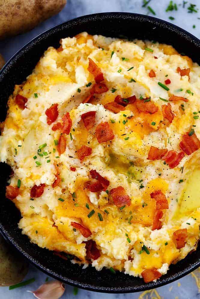 Cheddar Garlic Mashed Potato Casserole in a black bowl.