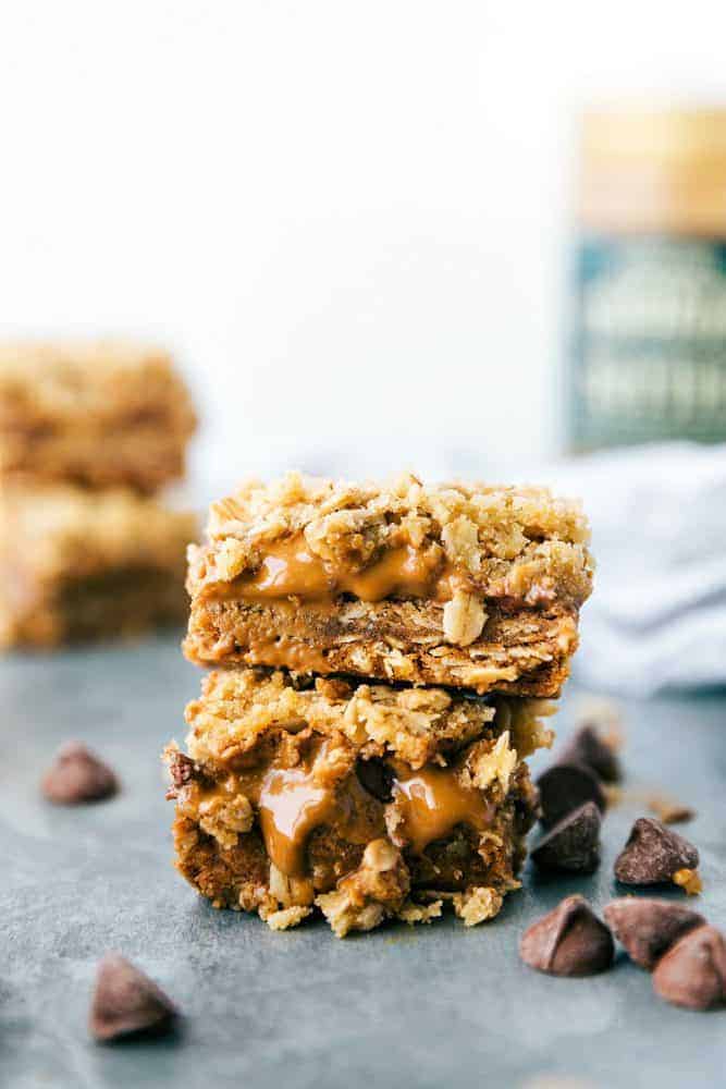 Biscoff Oatmeal bars stacked on top of each other with chocolate chips on the side.