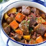 This beef stew is full of tender meat, colorful veggies and plenty of smoky bacon. A one pot meal that's perfect for cold weather!