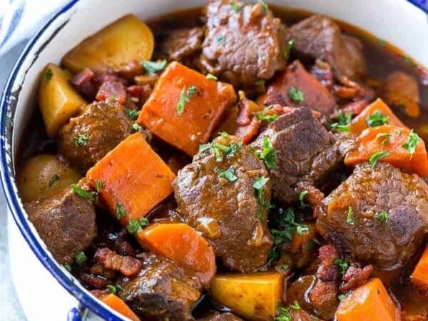 This beef stew is full of tender meat, colorful veggies and plenty of smoky bacon. A one pot meal that's perfect for cold weather!