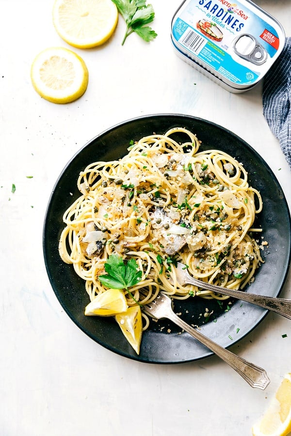 Healthy Lemon Parmesan Sardine Pasta on a black plate.