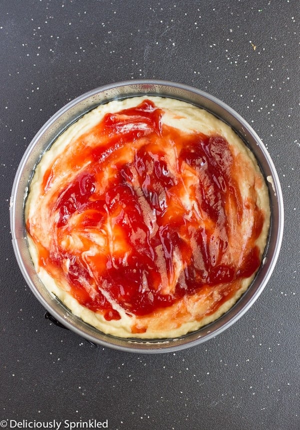 Strawberry jam layered on top of a buttery cake.