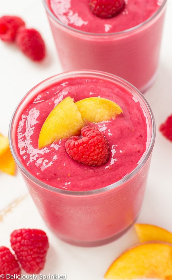 Raspberry Peach Smoothie in a glass cup.