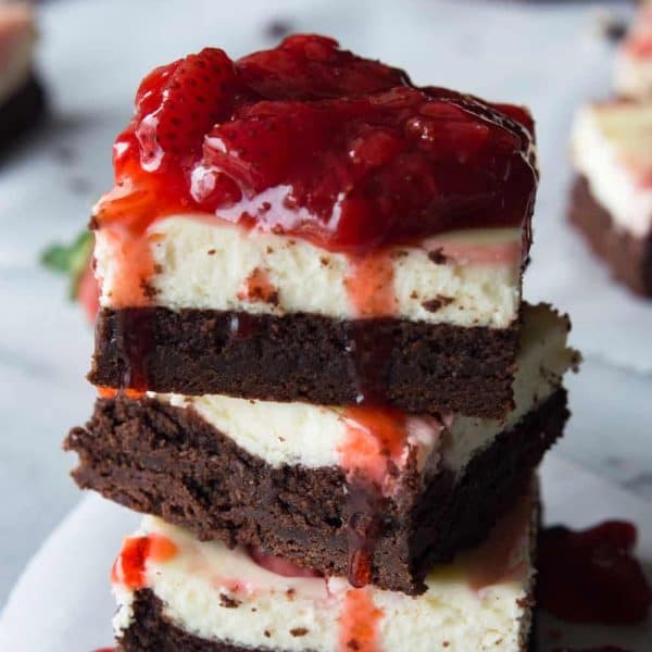 Strawberry Cheesecake Brownies. These homemade brownies are loaded up with a layer of creamy cheesecake then swirled with a sweet strawberry sauce for a pop of color and flavor! Spoon the extra strawberry sauce over the top for an extra special dessert!