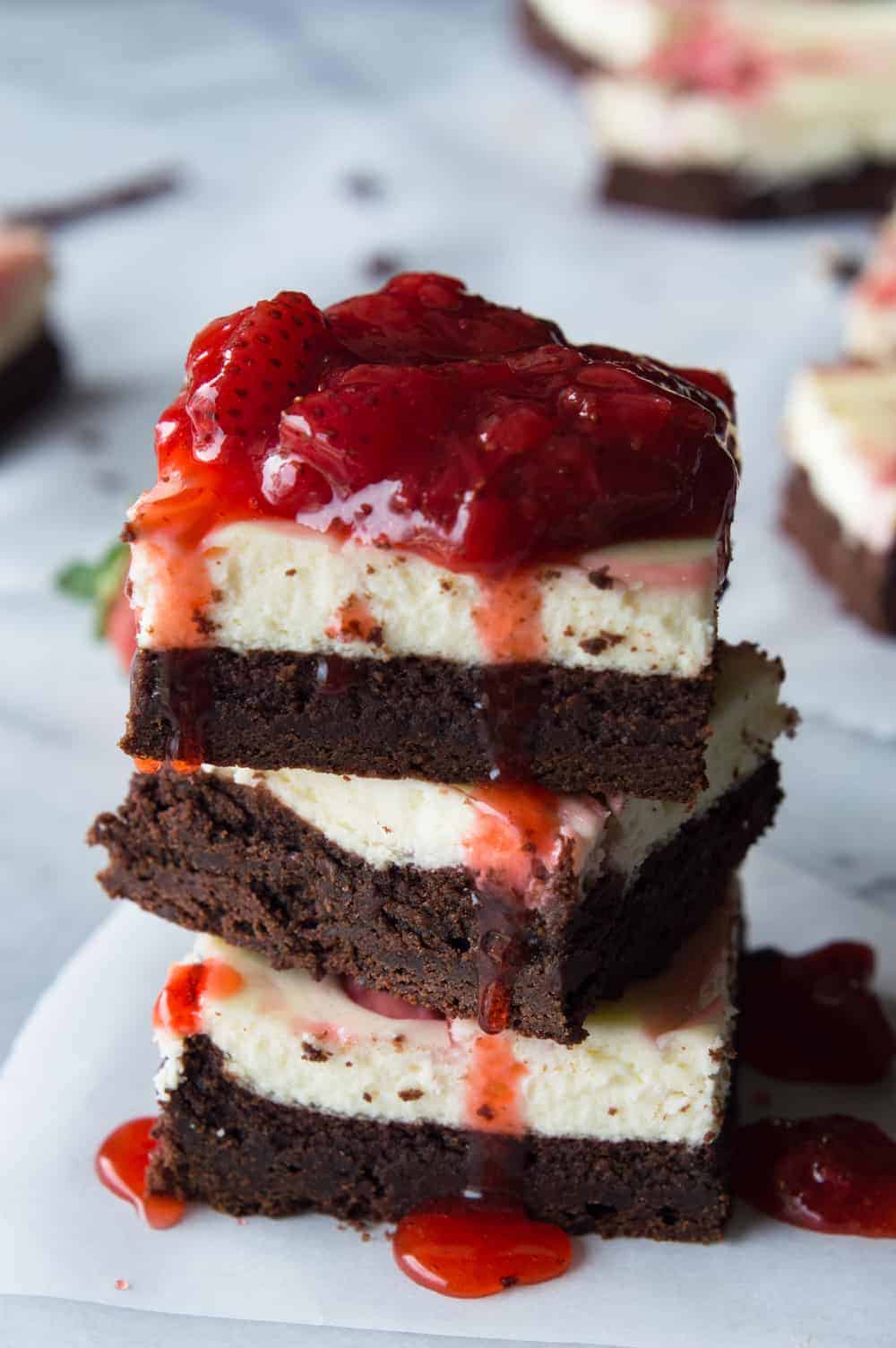 Strawberry Cheesecake Brownies. These homemade brownies are loaded up with a layer of creamy cheesecake then swirled with a sweet strawberry sauce for a pop of color and flavor! Spoon the extra strawberry sauce over the top for an extra special dessert!
