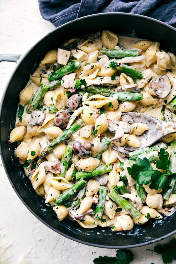 Cheesy Chicken, Asparagus, Bacon, and Mushroom Shells in a skillet.