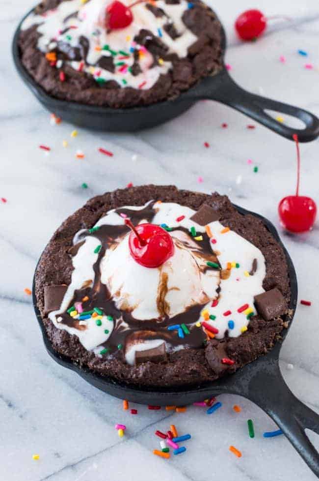 Skillet Brownie Sundaes in small cast iron skillets.