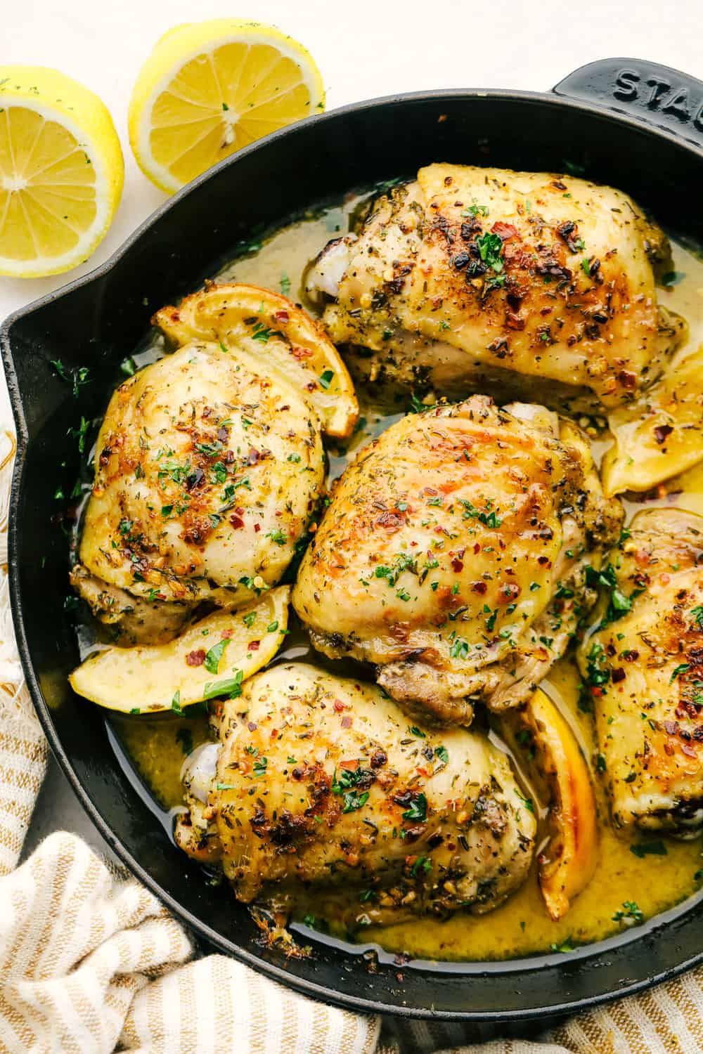 Greek Lemon Chicken in a cast iron skillet. 