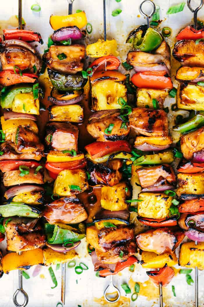 Hawaiian Teriyaki Chicken Skewers laid in rows.