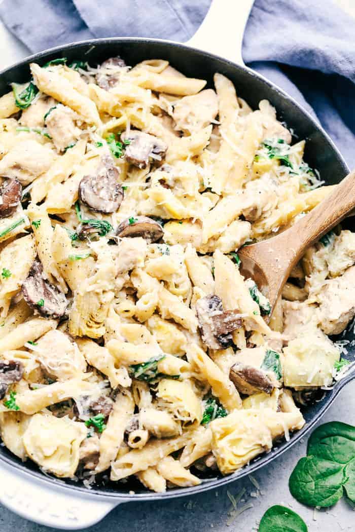 One Pot Creamy Spinach Mushroom Artichoke Chicken in a skillet.