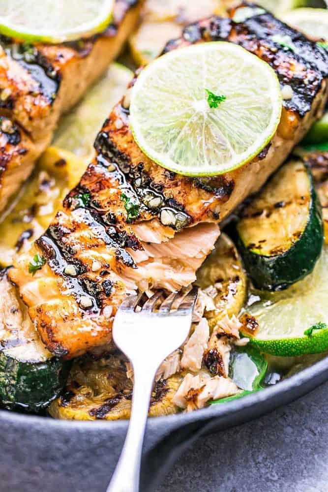 This Grilled Honey Lime Salmon being pulled apart with a fork.