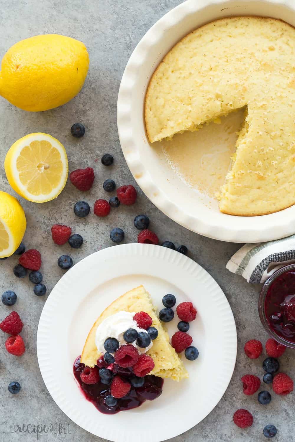 This Lemon Baked Pancake with Berry Sauce slice on a white plate.