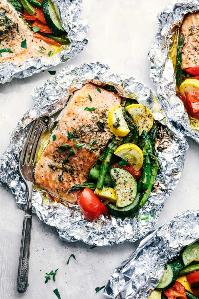 Butter Garlic Herb Salmon Foil Packets with a fork.